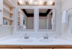 Master bathroom with double vanity and shower